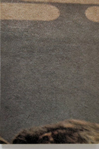 Close-up of 1977 Topps Star Wars Yellow Series 3 trading card corner on textured background