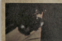 Close-up of vintage 1977 Topps Star Wars Yellow Series 3 trading card corner with visible wear and texture