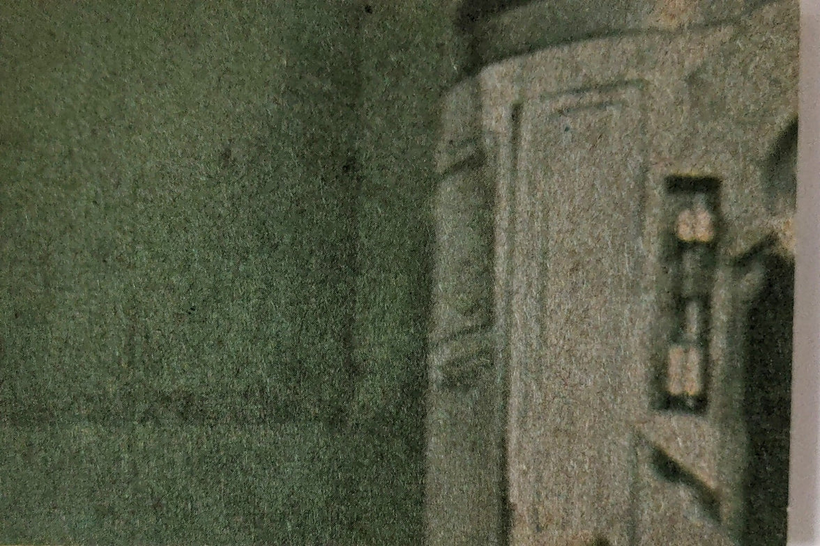 Close-up of vintage 1977 Topps Star Wars yellow Series 3 trading card corner with textured background