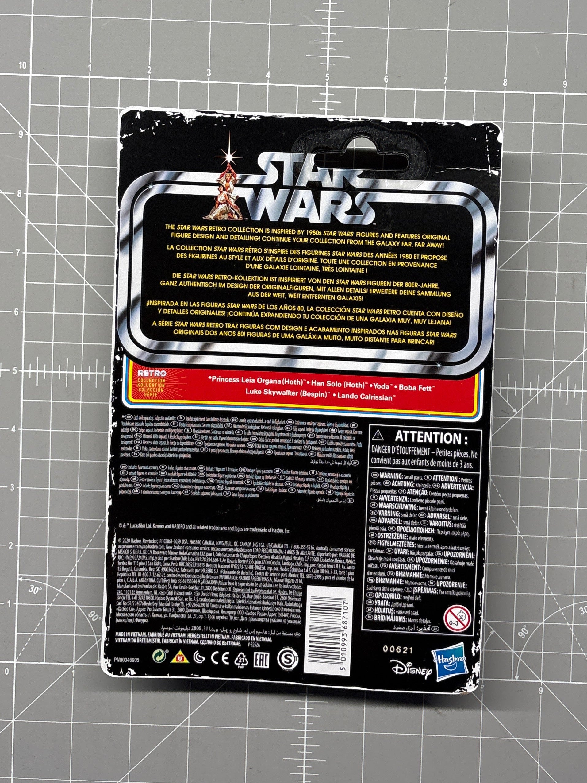 Back of Star Wars collectible packaging with multilingual text, warning labels, barcode, and Disney and Hasbro logos