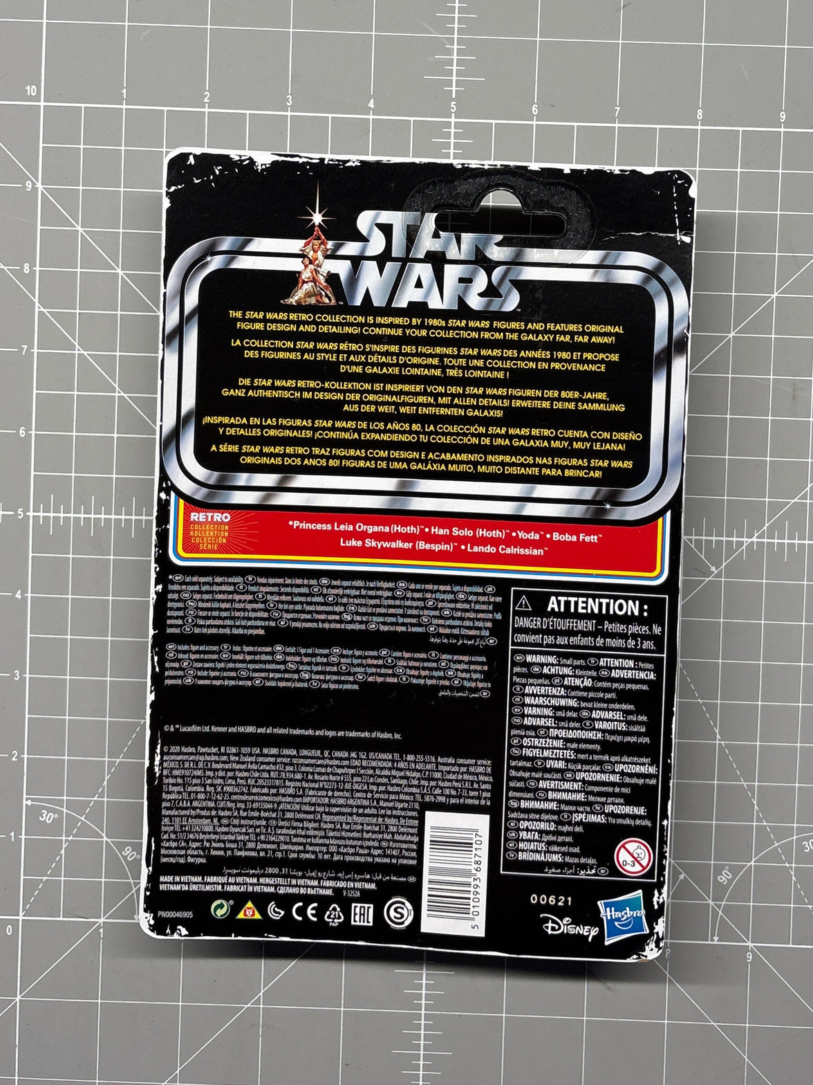 Back of Star Wars collectible packaging with multilingual text, warning labels, barcode, and Disney and Hasbro logos