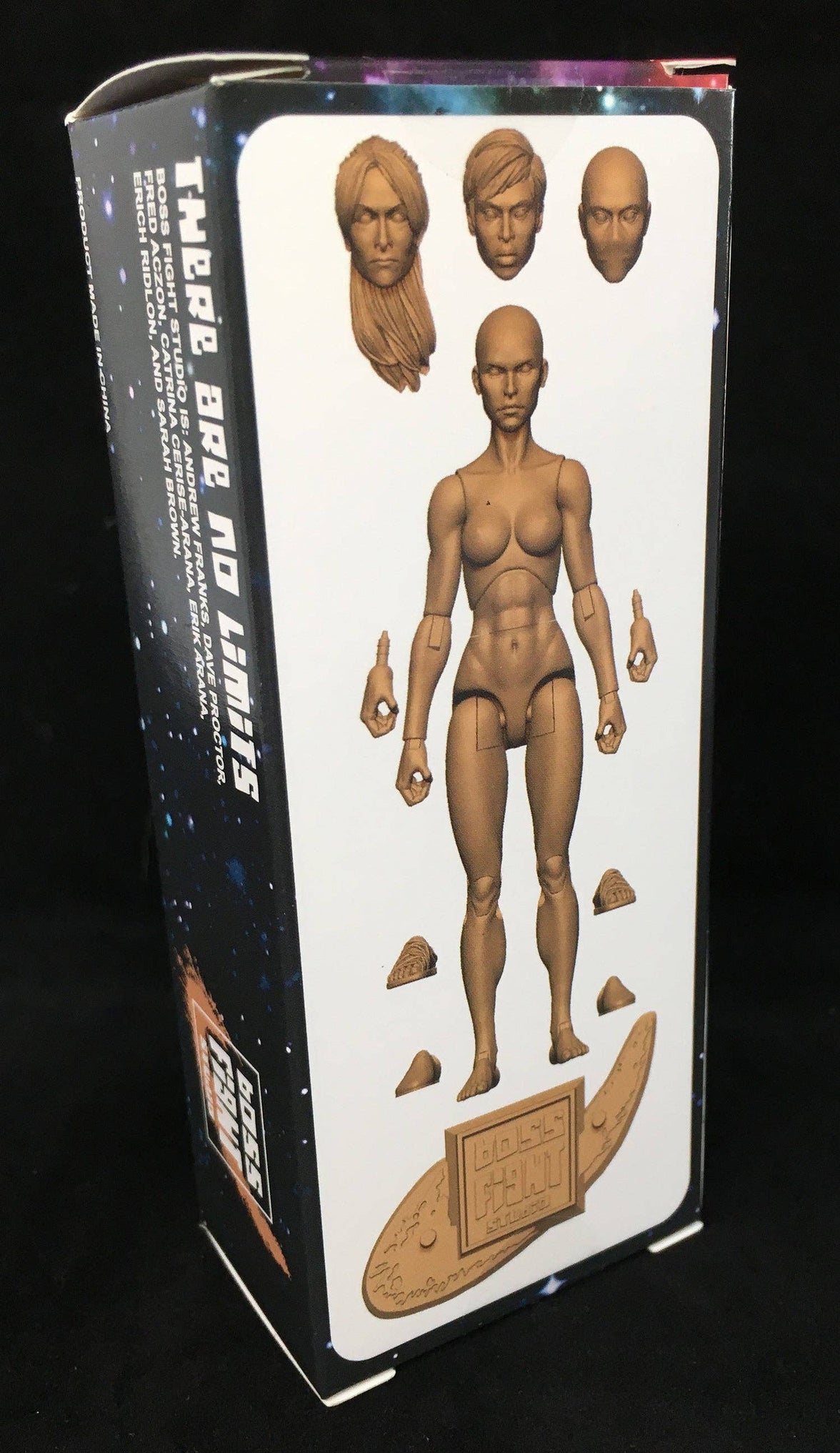 Unpainted articulated female figure with three distinct head sculpts, extra hands, feet parts, and a textured display base on black background