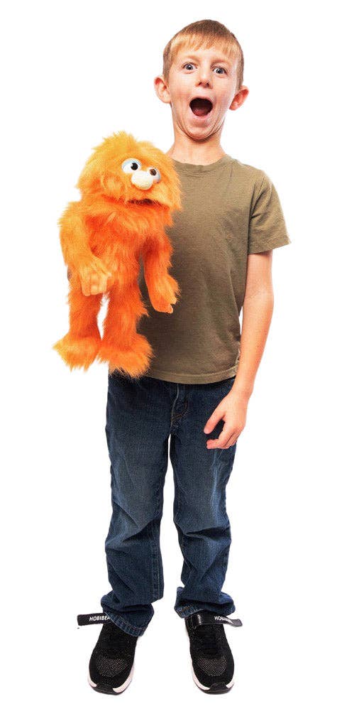 Silly Puppets - Silly Puppets Monster, Orange (14") plush with bright orange fur held by excited young boy in casual outfit