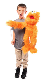 Silly Puppets - Silly Puppets Monster, Orange (30") plush puppet with bright orange fur and movable mouth held by boy in gray shirt