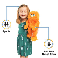 Silly Puppets - Silly Puppets Monster, Orange (14") plush with bright orange fur and green nose held by smiling young girl in green dress