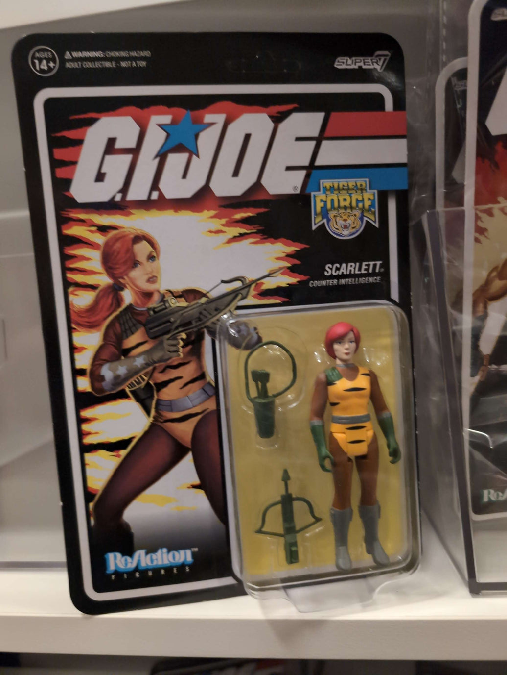 GI Joe Retro Collection Scarlet action figure in Tiger Force outfit with weapons in Super7 branded packaging