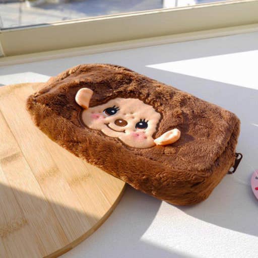 Official Sekiguchi Monchhichi Square Plush Pouch by K-Wonderland featuring a soft spacious character design, often searched as a Monchichi organizer.