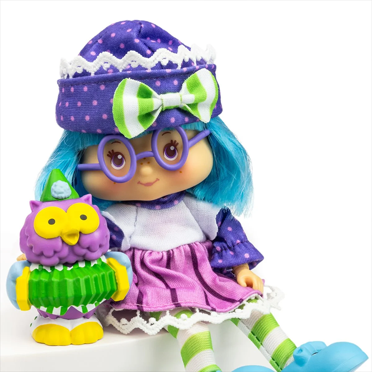 Strawberry Shortcake Plum Pudding doll with blue hair, purple glasses, and purple striped outfit by Loyal Subjects