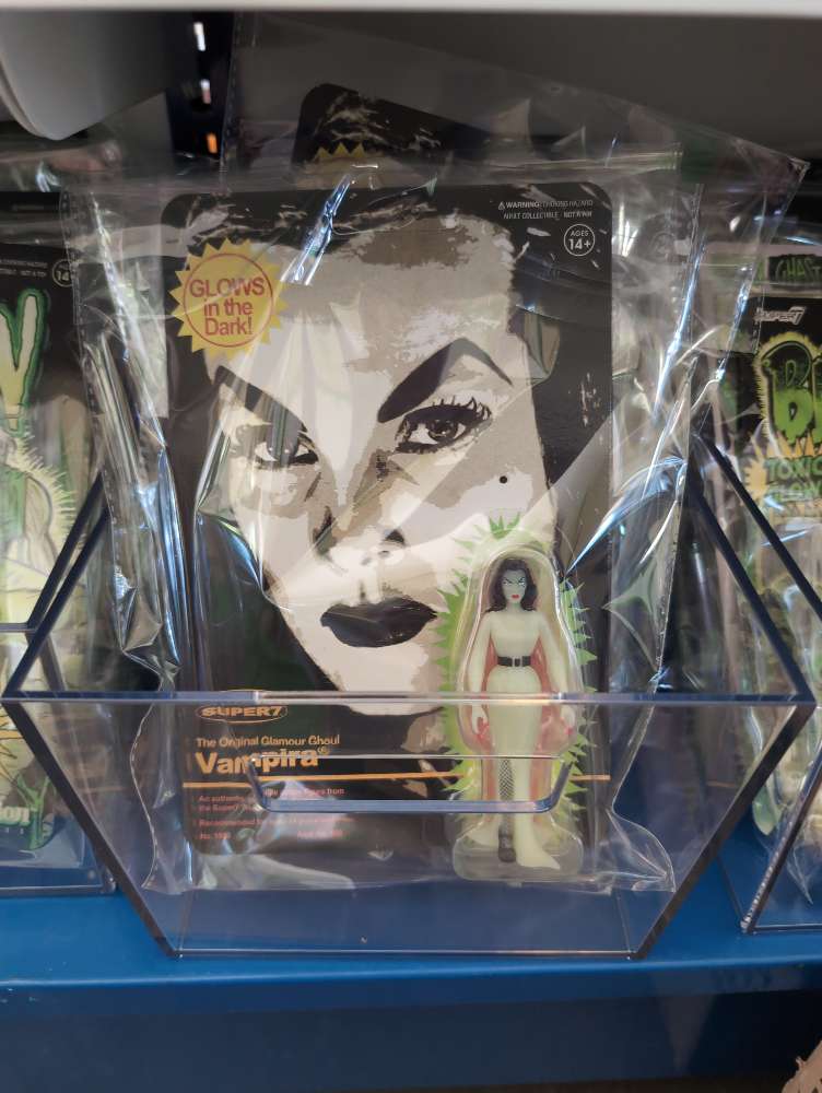 Super7 Vampira glow-in-the-dark 3.75-inch ReAction figure in sealed blister pack with black and white card art