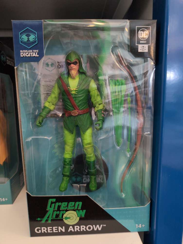 McFarlane Green Arrow DC Direct 7-inch action figure with green outfit, hood, bow, and quiver in packaging