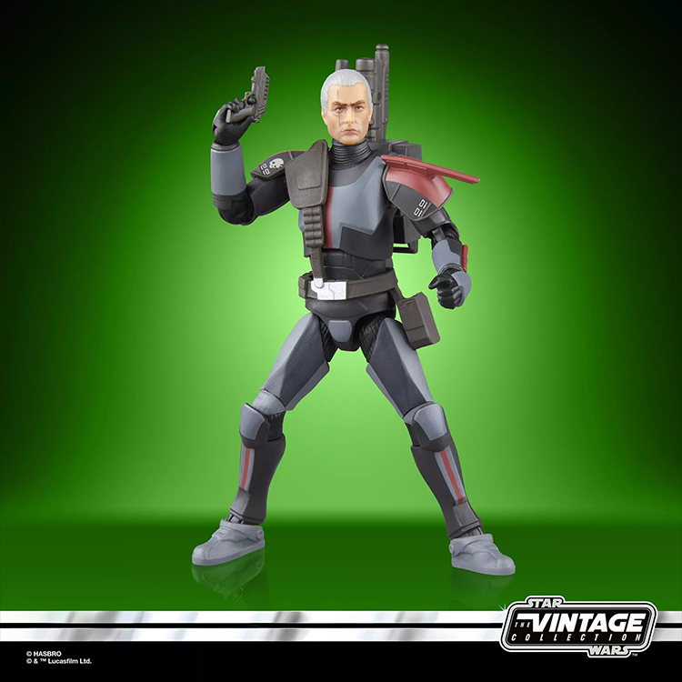 Kenner Star Wars Vintage Collection Crosshair action figure posed with blaster on green background