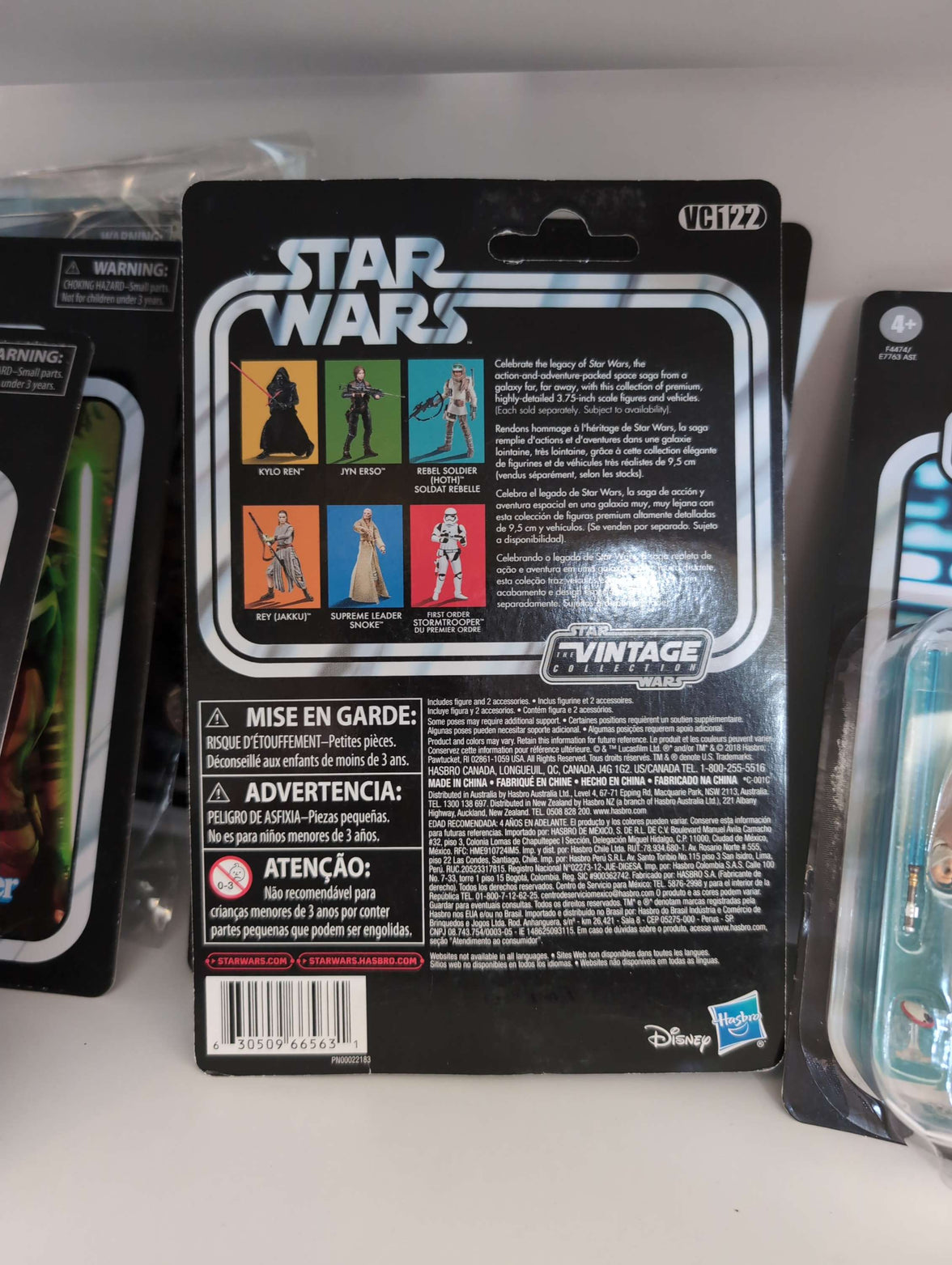 Rey Island Journey Star Wars Vintage Collection Action Figure by Hasbro in original packaging with character images and logo on black card back.