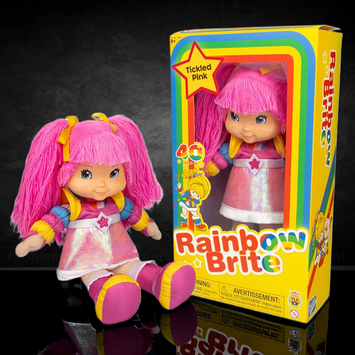 The Loyal Subjects Rainbow Brite Tickled Pink 12-inch doll with pink hair and iridescent dress in colorful packaging