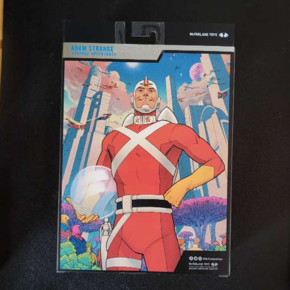 Adam Strange comic art on McFarlane Toys DC Multiverse action figure packaging background close-up
