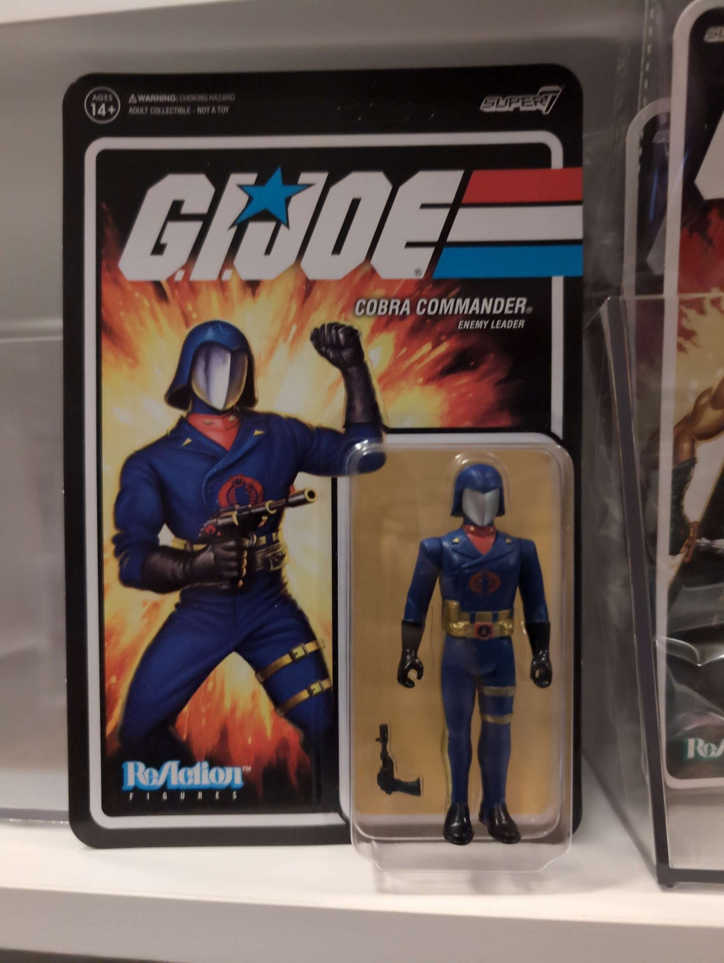 GI Joe Cobra Commander action figure in blue dress uniform with helmet and weapon in Super7 retro style packaging