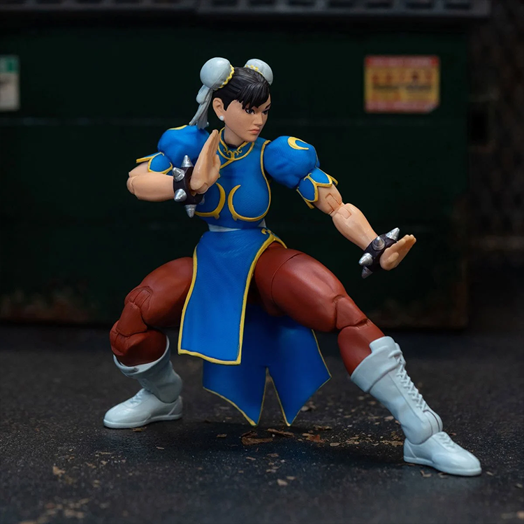 Jada Toys Ultra Street Fighter II Chun-Li 6-inch action figure in blue qipao outfit with fighting pose on dark background