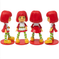 Boss Fight Studio Llc deluxe Strawberry Shortcake figure with red hair, green striped tights, yellow shoes, and white apron stand display