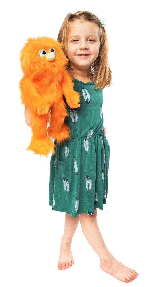 Silly Puppets - Silly Puppets Monster, Orange (14") plush with bright orange fur and yellow nose held by smiling young girl in green dress