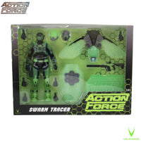Green action figure with accessories displayed in a clear box marked Action Force Swarm Tracer