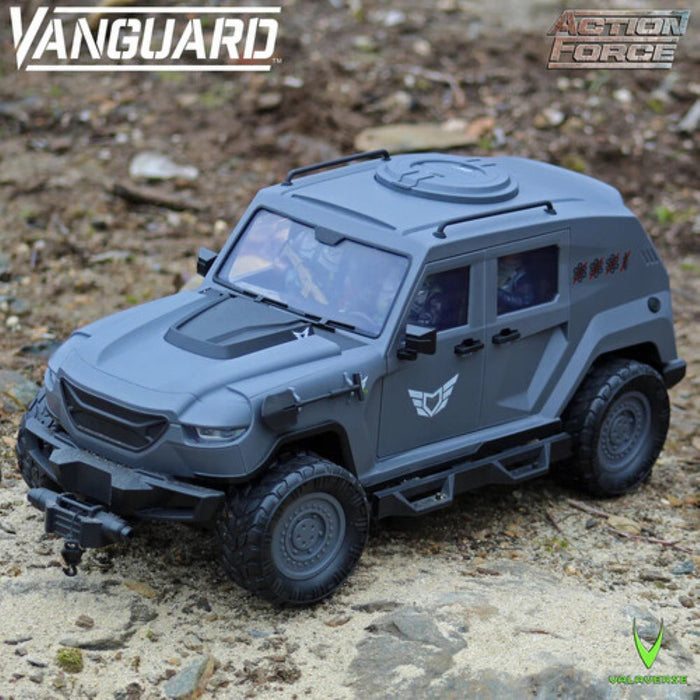 Gray armored off road vehicle toy on rocky ground with Vanguard and Action Force logos