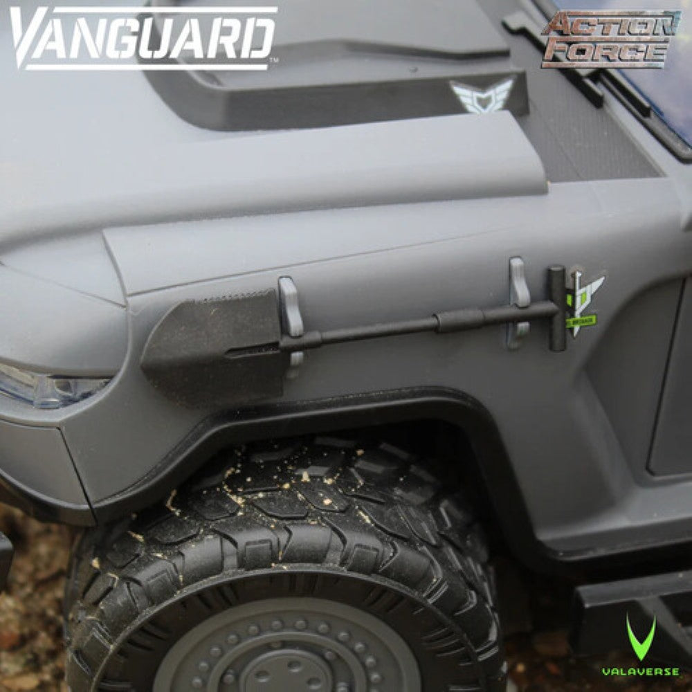 Close up of a gray off road toy vehicle with a rugged tire and Vanguard and Action Force logos