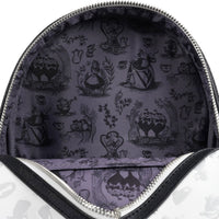 Close-up of a lavender fabric interior with black silhouettes of characters and teacups inside a zippered pouch or bag.