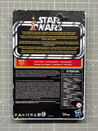 Back of Star Wars Retro Collection packaging with character names and Disney and Hasbro logos on a cutting mat