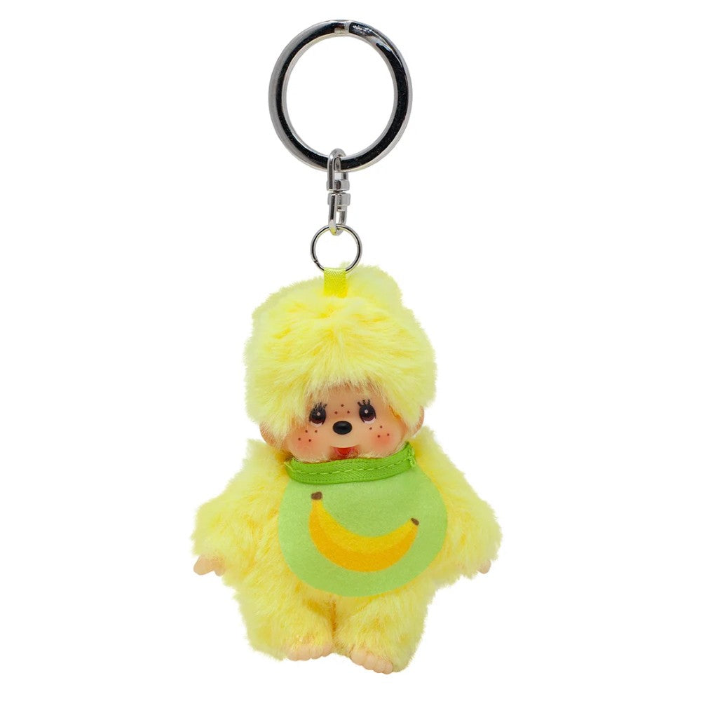 Yellow plush doll keychain with a green bib and banana motif