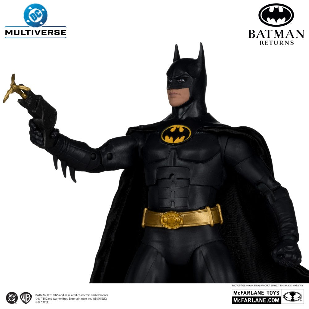 McFarlane 7-inch DC Multiverse Batman Returns action figure in black suit with gold belt holding grappling gun