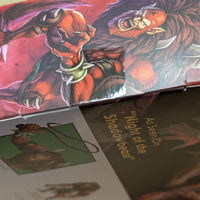 Close-up of Beast-Man Masters of the Universe Origins Deluxe action figure packaging artwork by Mattel with whip detail