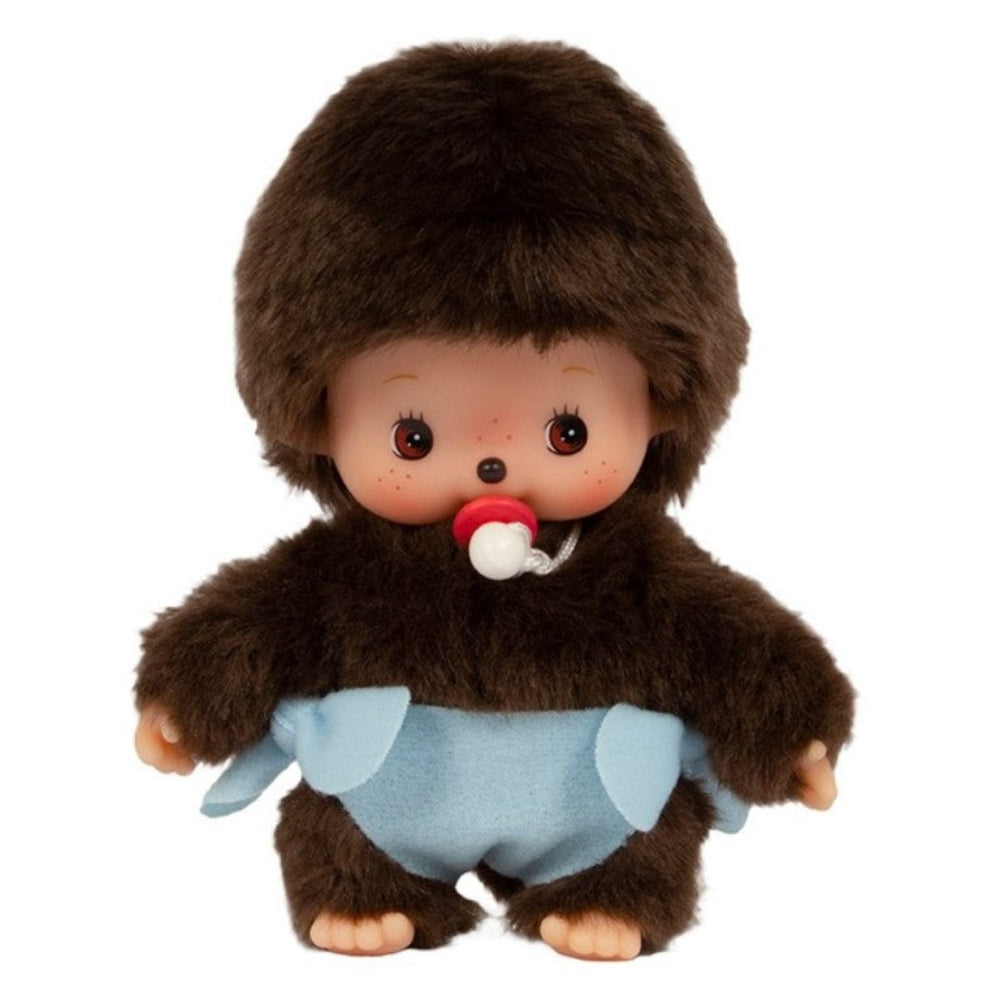 Stuffed toy resembling a baby with a brown fur outfit and blue diaper on a white background