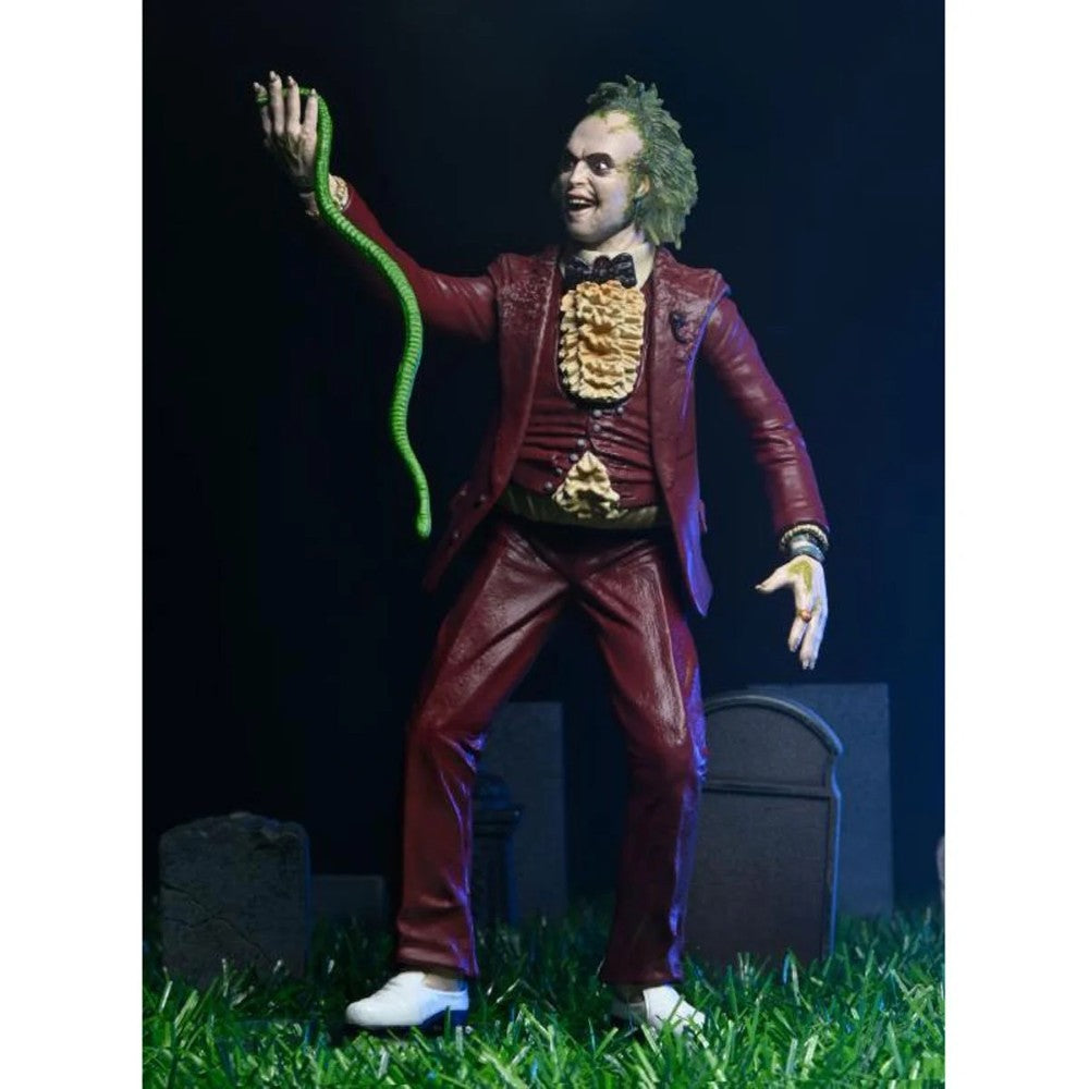 Beetlejuice (1988) Red Tuxedo NECA 7-Inch Scale Action Figure posed holding green snake in detailed suit new collectible toy