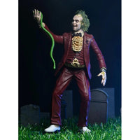 Beetlejuice (1988) Red Tuxedo NECA 7-Inch Scale Action Figure posed holding green snake in detailed suit new collectible toy