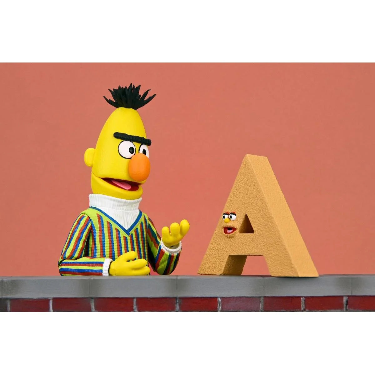Bert - Sesame Street Ultimate NECA 7-Inch Scale Action Figure in striped sweater with animated letter A collectible by Neca