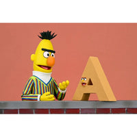 Bert - Sesame Street Ultimate NECA 7-Inch Scale Action Figure in striped sweater with animated letter A collectible by Neca