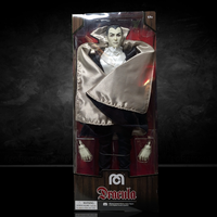 Mego 8-inch Dracula figure with satin cape and white ruffled collar featuring extra hand accessories in clear packaging