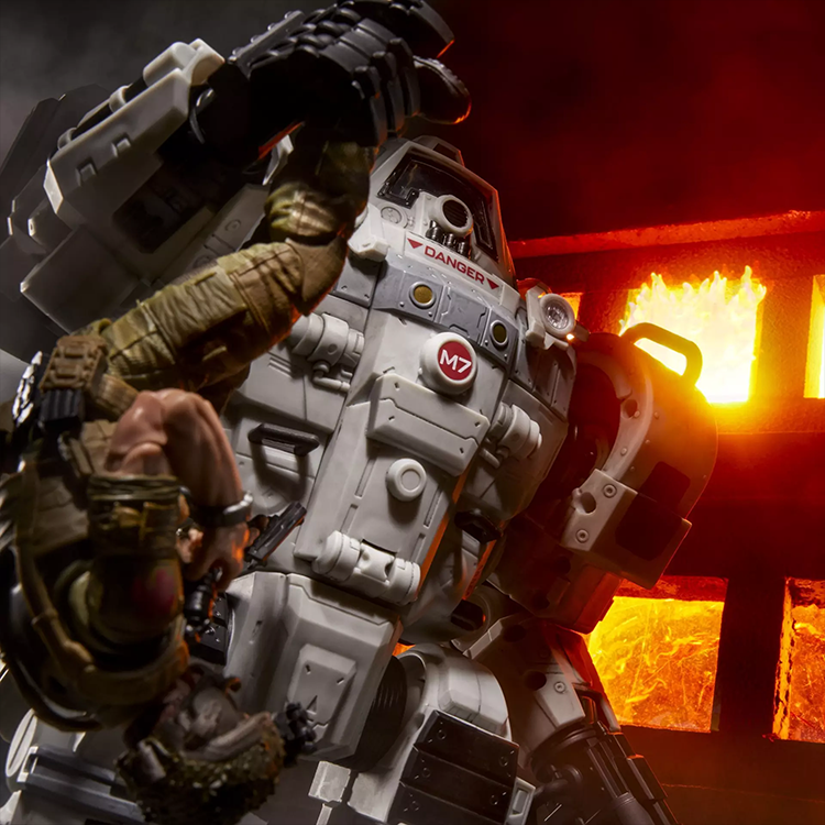 Hasbro G.I. Joe Cobra S.N.A.K.E Battle Suit holding action figure against fiery background