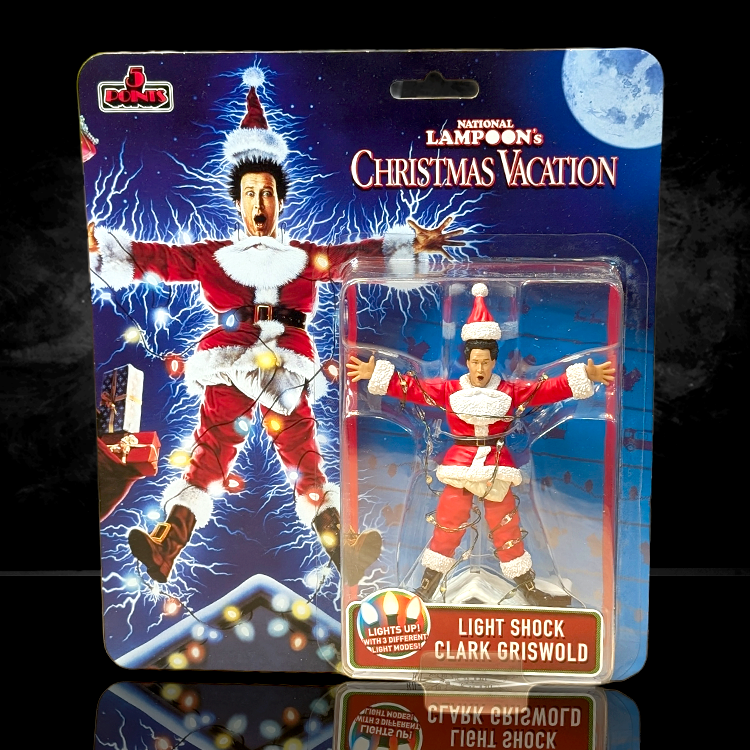 Super7 National Lampoon’s Christmas Vacation Light-Shock Clark Griswold 5 Points figure in festive packaging with lightning effects