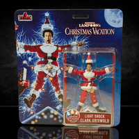 Super7 National Lampoon’s Christmas Vacation Light-Shock Clark Griswold action figure with light-up feature in holiday outfit packaging