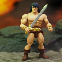 Muscular barbarian character holding a sword against a rocky backdrop