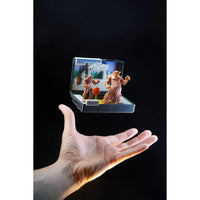 A hand presenting the Console Heroes Sega Genesis Genesis Altered Beast Cartridge Diorama Playset with detailed figures and backdrop.