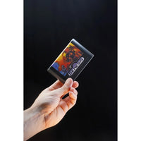 Hand holding Console Heroes Sega Genesis Genesis Altered Beast Cartridge Diorama Playset against black background