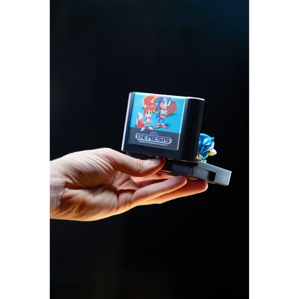 Hand holding Console Heroes Sega Genesis Sonic the Hedgehog 2 Cartridge Diorama Playset with Sonic figure visible