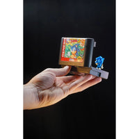 Hand holding Console Heroes Sega Genesis Sonic the Hedgehog 3 Cartridge Diorama Playset (Copy) collectible toy display.