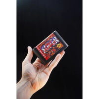 Console Heroes Sega Genesis Genesis Street Fighter II Cartridge Diorama Playset held in hand floating on black background.