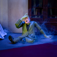 Scooby-Doo Creeper action figure by Jada Toys sitting on floor with startled expression and blue smoke effects.