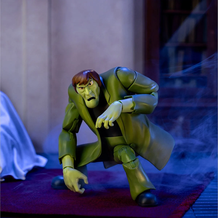 Scooby-Doo Creeper 1:12 scale action figure by Jada Toys in signature green coat posed on red carpet.