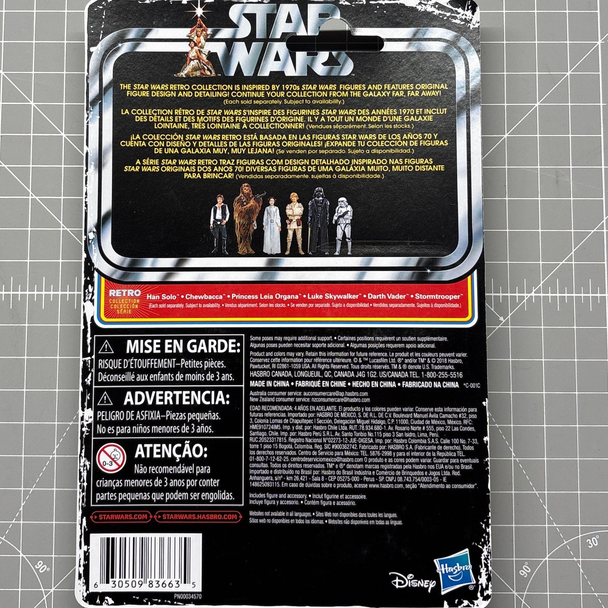 Back of Star Wars action figure packaging with character lineup, multilingual text, warnings, Disney and Hasbro logos