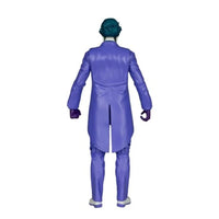 Back view of an action figure wearing a long purple coat, purple trousers, gloves, and dark teal hair