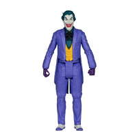 Joker action figure wearing a purple suit with a yellow vest and green hair